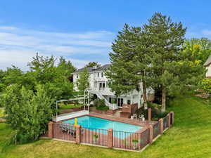 View of swimming pool featuring stairs and a patio