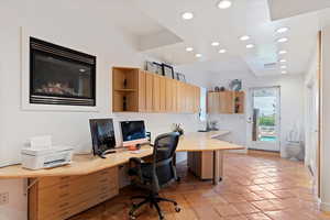 Office space with recessed lighting, built in study area, and light tile patterned floors