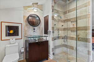 Bathroom with vanity and a stall shower