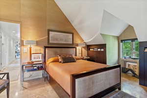 Bedroom with vaulted ceiling