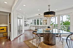 Dining space with recessed lighting, dark wood-style floors, and french doors