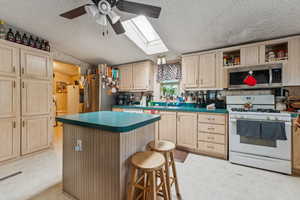 Kitchen with gas range and island.  A must see!  Great size.