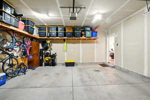 Garage featuring a garage door opener