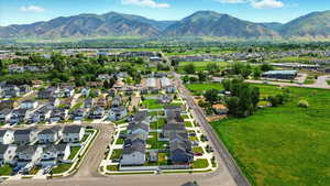 Aerial perspective of suburban area featuring a mountain backdrop
