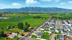 Aerial view of residential area featuring a mountainous background