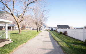 View of asphalt road with a residential view
