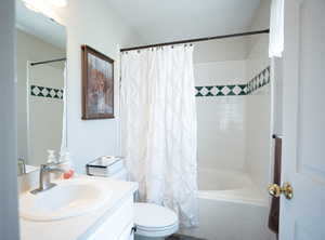 Bathroom with vanity and tiled shower / bath combo