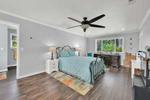 Bedroom with multiple windows, dark wood-style floors, ornamental molding, a ceiling fan, and recessed lighting