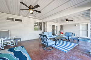 View of patio with ceiling fan and outdoor lounge area