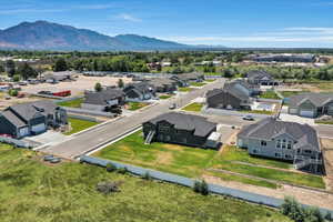 Aerial view of residential area featuring a mountainous background