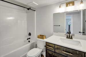Full bathroom featuring tub / shower combination and vanity