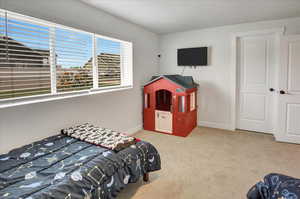 Bedroom with carpet and baseboards