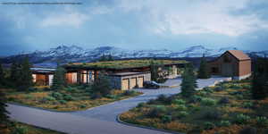 View of front of home featuring a mountain view and a garage