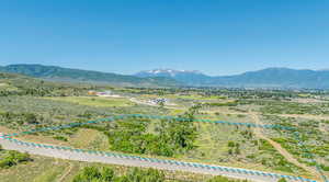 View of mountain backdrop featuring rural landscape
