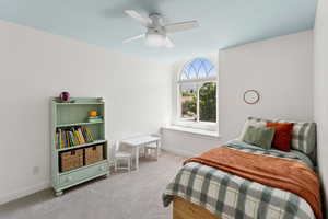 Bedroom with carpet and a ceiling fan