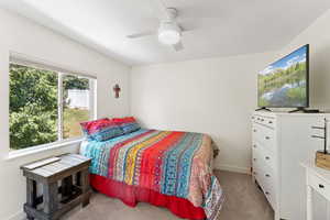 Bedroom featuring carpet and ceiling fan