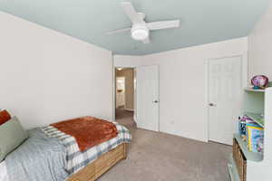 Bedroom featuring carpet floors and ceiling fan