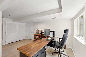 Office area featuring light carpet, a textured ceiling, and recessed lighting