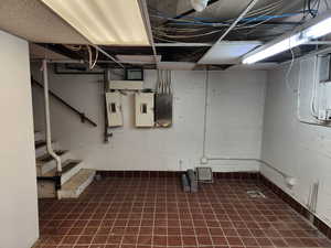 Electrical boxes are located  on west side of room. Dropped ceiling panels available