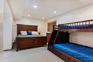 Bedroom featuring light carpet and recessed lighting