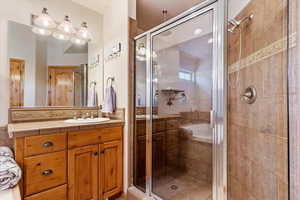 Bathroom with a shower stall and vanity