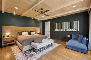 Bedroom featuring a wooden ceiling with exposed beams, wood finished floors, ceiling fan, and recessed lighting