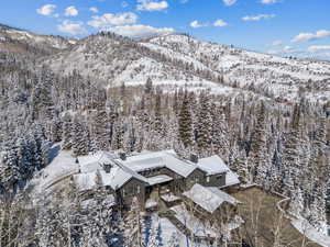 Snowy aerial view featuring a mountain view