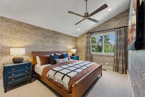 Bedroom featuring wallpapered walls, vaulted ceiling, carpet floors, recessed lighting, and ceiling fan