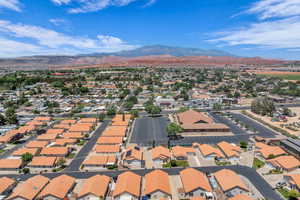 Aerial view of residential area featuring a mountain backdrop