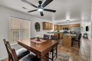 Dining space with a ceiling fan