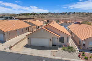 Aerial perspective of suburban area featuring a mountainous background