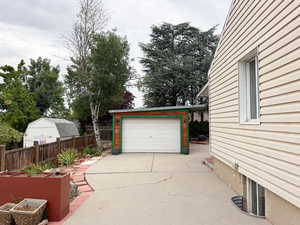 Garage featuring driveway