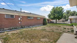 View of property exterior with brick siding