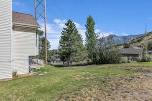 View of green lawn with a mountain view
