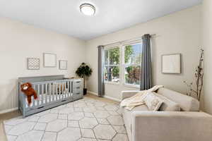 Bedroom with light carpet