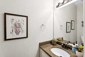 Bathroom with vanity and toilet