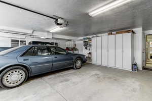 Garage featuring a garage door opener