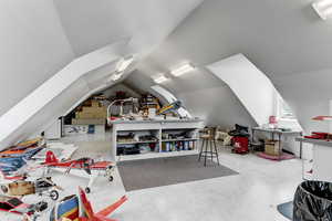 Additional living space featuring lofted ceiling