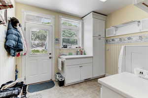 Washroom featuring a sink and baseboards