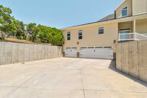 View of home's exterior featuring an attached garage and concrete driveway