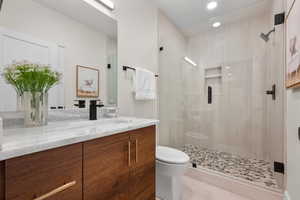 Full bath with vanity, a stall shower, and recessed lighting