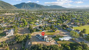 View of property location with a mountainous background and nearby suburban area