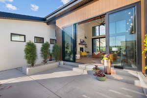 Property entrance featuring a patio area