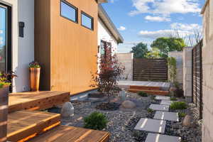 View of yard with a wooden deck