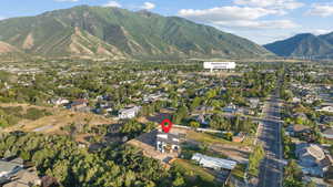 View of property location with mountains and nearby suburban area