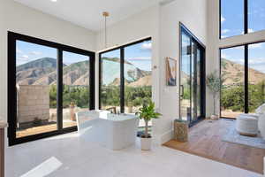 Dining area with a mountain view and tile patterned flooring