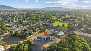 Aerial overview of property's location with nearby suburban area