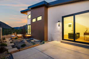 Zen Garden from the study...Property exterior at dusk with a patio area and a mountain view