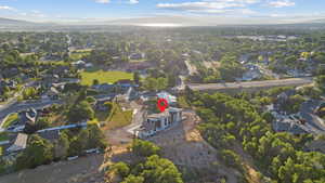 View of property location featuring a mountain backdrop and nearby suburban area