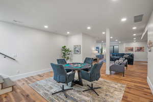 Dining room featuring light wood finished floors and recessed lighting